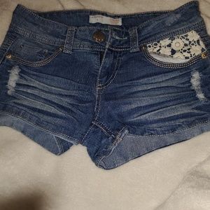 Distressed denim shorts